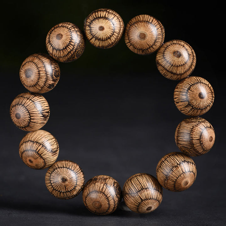 Bracelet de protection en perles de bois de Gnetum et pierres de Buddha Stones - image 5