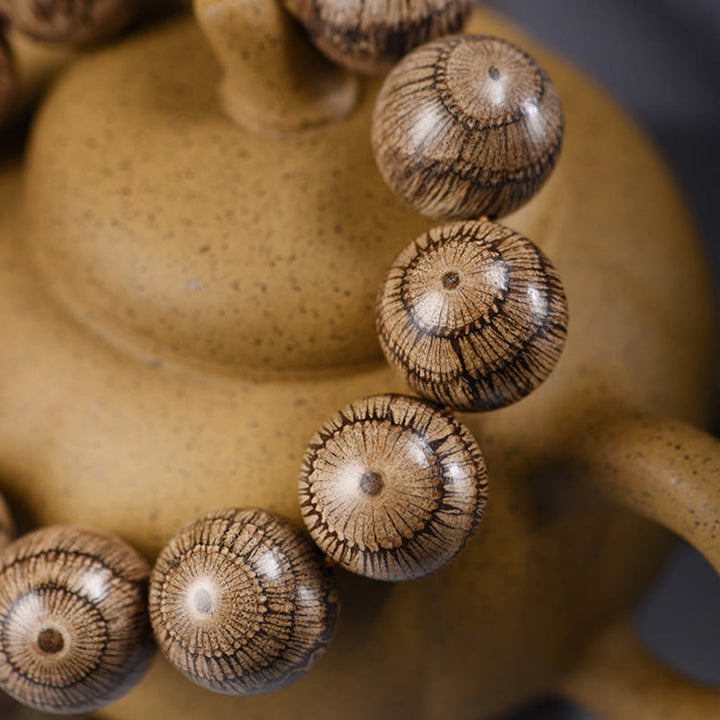 Bracelet de protection en perles de bois de Gnetum et pierres de Buddha Stones - image 4