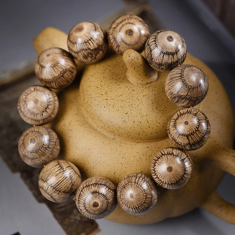 Bracelet de protection en perles de bois de Gnetum et pierres de Buddha Stones - image 2