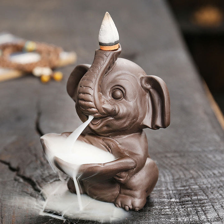 Buddha Stones Petit éléphant tenant une feuille Fontaine de fumée à refoulement en argile violette Brûleur d'encens de guérison Décoration - image 3