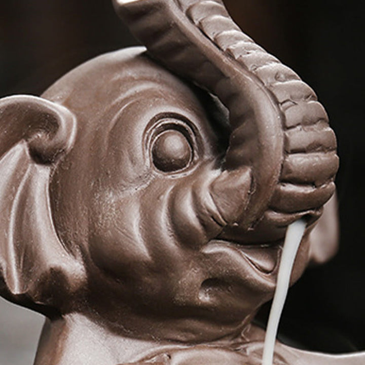 Buddha Stones Petit éléphant tenant une feuille Fontaine de fumée à refoulement en argile violette Brûleur d'encens de guérison Décoration - image 11