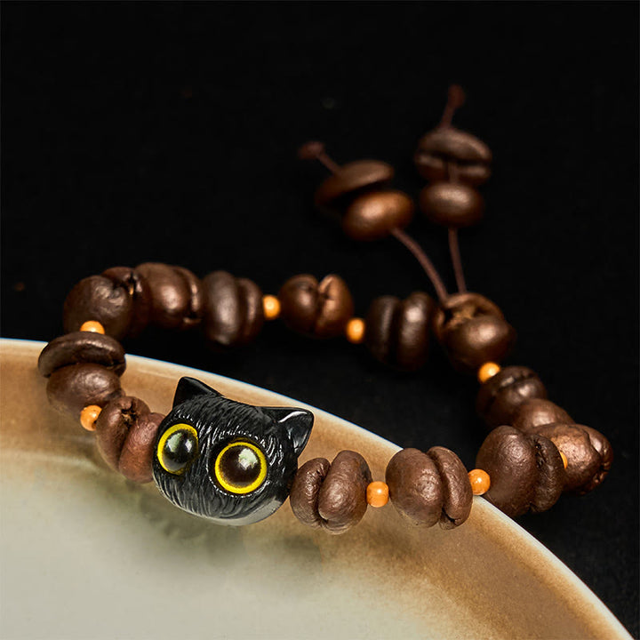 Bracelet de paix en forme de griffe et de patte de chat en grains de café naturels faits à la main avec des Buddha Stones - Tête de chat noir (tour de poignet 14-17 cm) - image 1