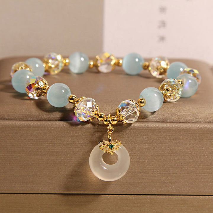 Bracelet d'équilibre avec boucle de paix et Buddha Stones, œil de chat bleu et cristal blanc - Œil de chat bleu (tour de poignet : 15-19 cm) - image 1