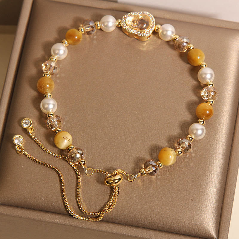 Bracelet de prospérité en pierre œil de chat jaune et perle de calebasse - image 4