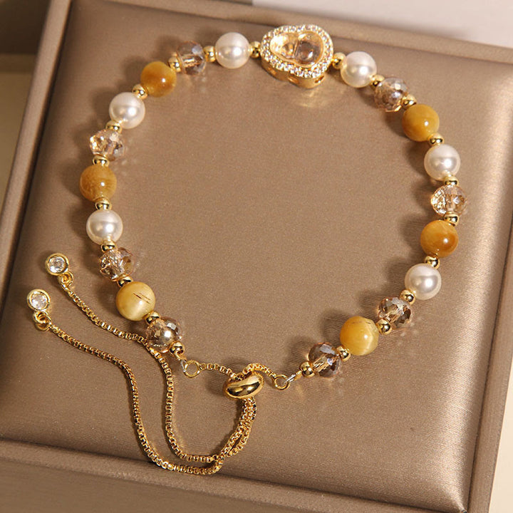 Bracelet de prospérité en pierre œil de chat jaune et perle de calebasse - image 4