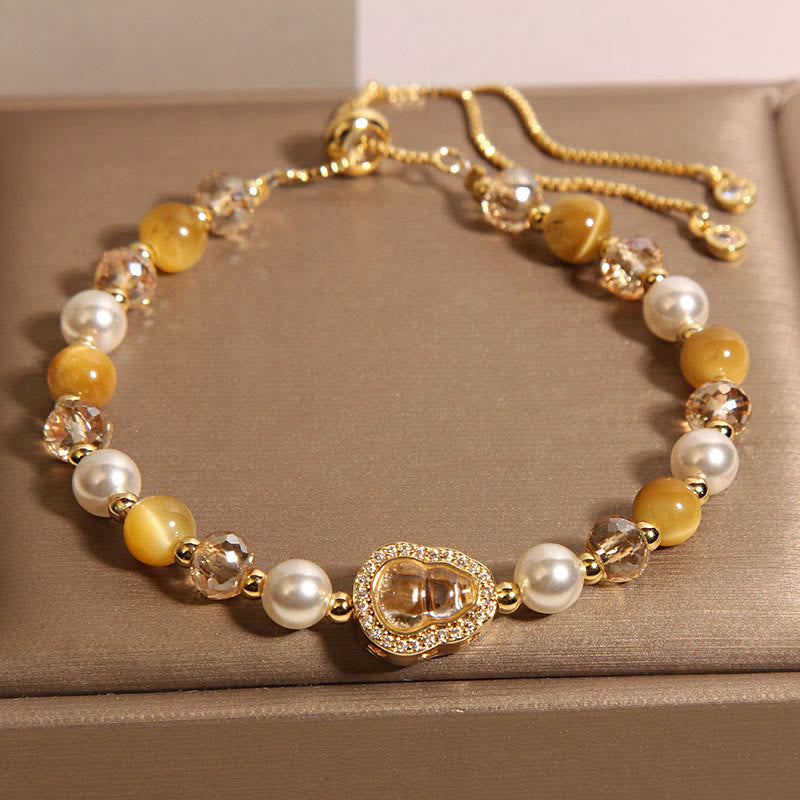 Bracelet de prospérité en pierre œil de chat jaune et perle de calebasse - image 3