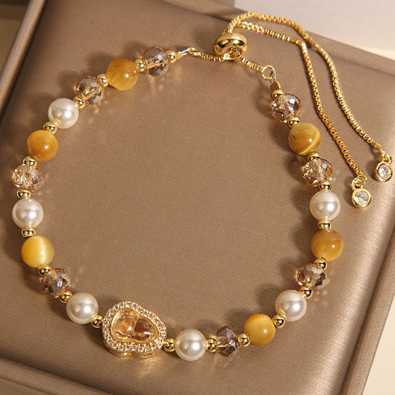 Bracelet de prospérité en pierre œil de chat jaune et perle de calebasse - image 2