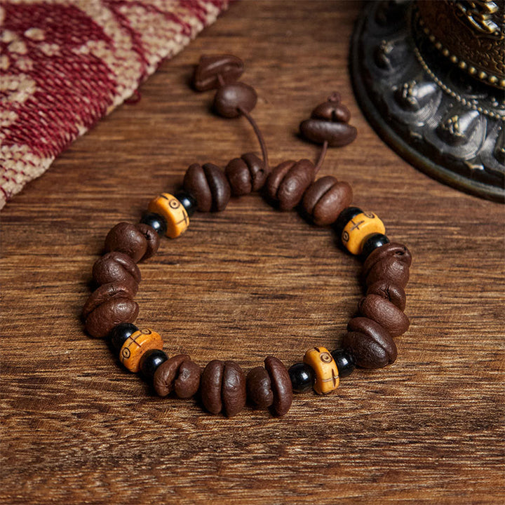 Bracelet de perles en os de yak et grains de café naturels Buddha Stones