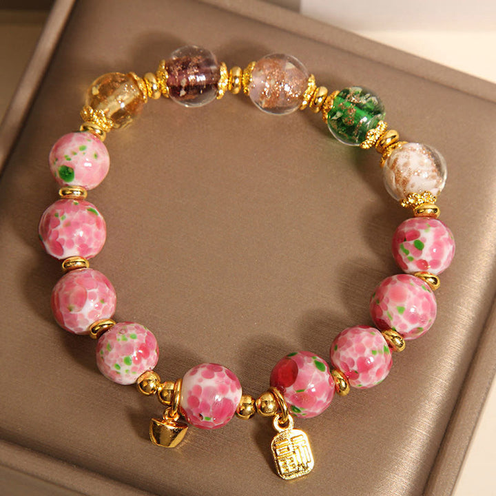 Bracelet porte-bonheur Liuli rose Buddha Stones et personnage Fu - image 3