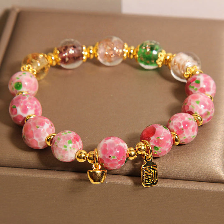 Bracelet porte-bonheur Liuli rose Buddha Stones et personnage Fu - image 2