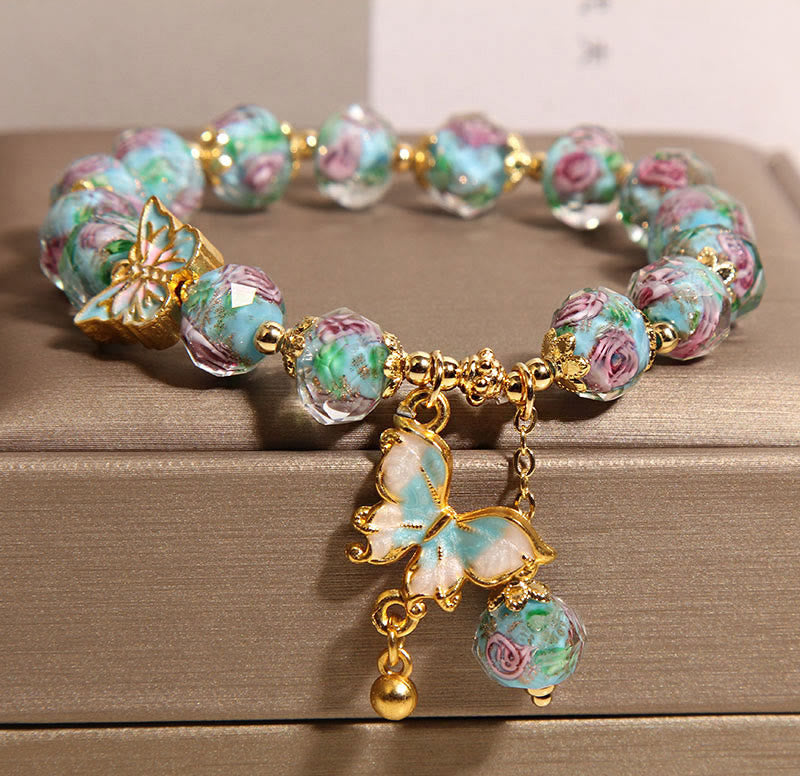 Bracelet Liuli avec breloque papillon et fleur de rose et Buddha Stones - image 1