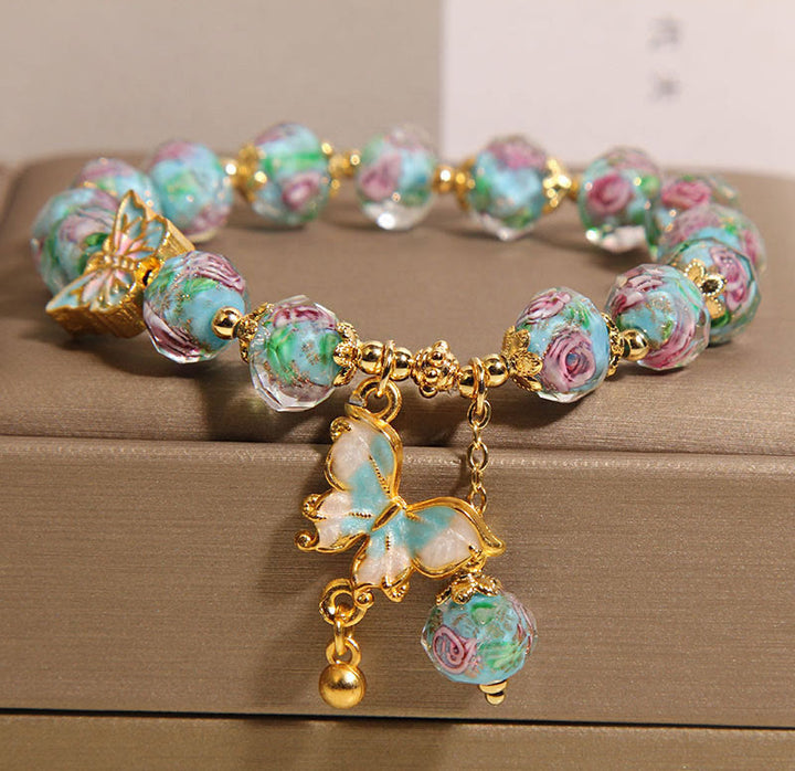 Bracelet Liuli avec breloque papillon et fleur de rose et Buddha Stones - Blue Liuli (tour de poignet : 18 cm) - image 0