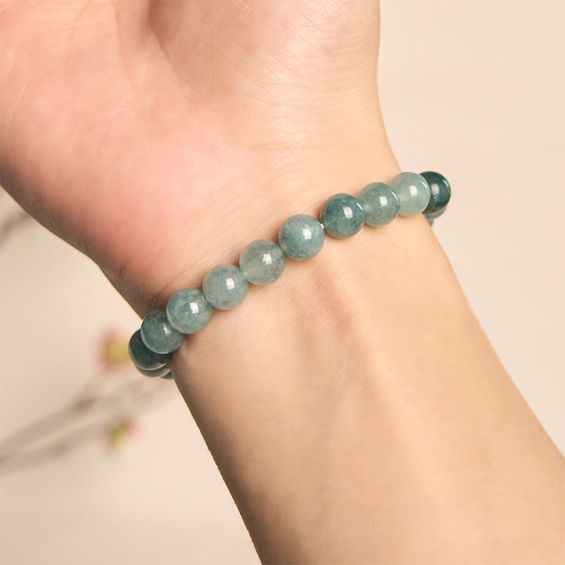 Bracelet de prospérité en perles de jade bleu et Buddha Stones