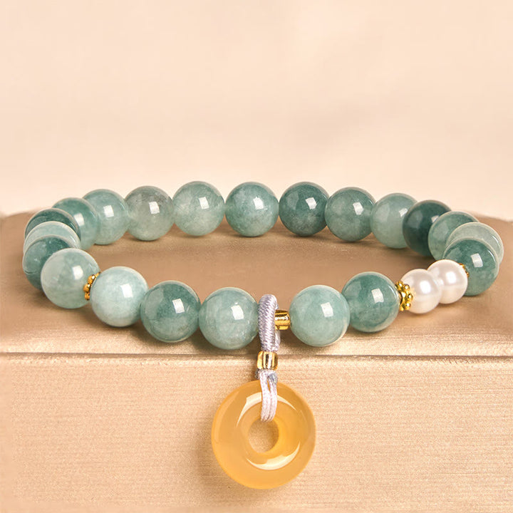 Bracelet de prospérité en perles de jade bleu et Buddha Stones