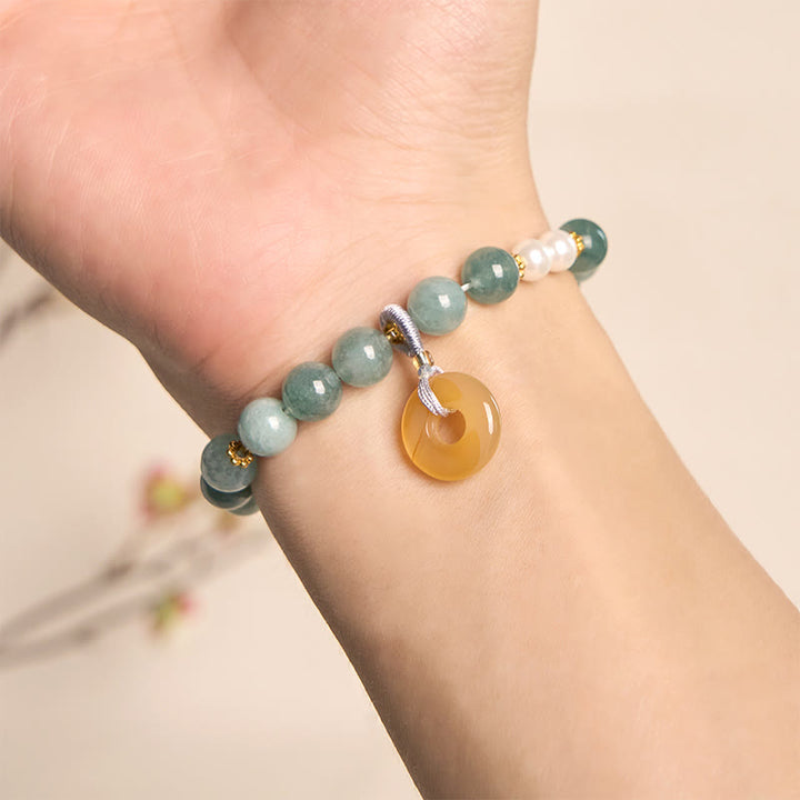 Bracelet de prospérité en perles de jade bleu et Buddha Stones