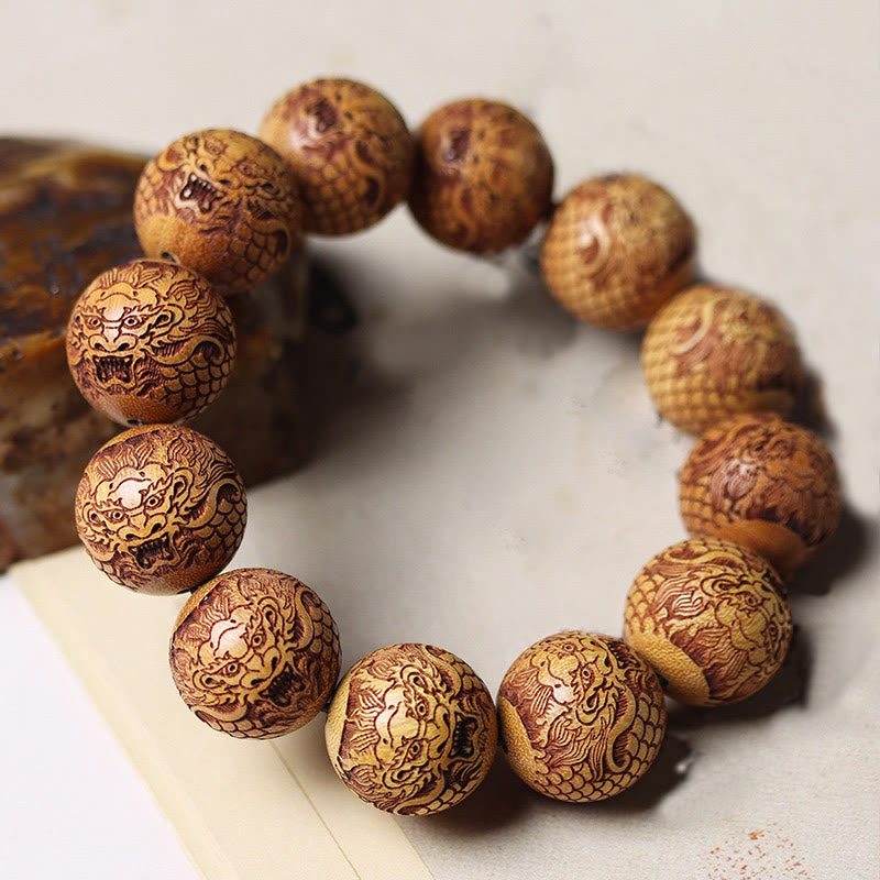 Bracelet en bois de santal sculpté avec des Buddha Stones et un dragon pour éloigner les mauvais esprits - image 2