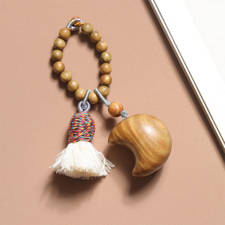 Porte-clés en corde de bois de santal vert naturel avec Buddha Stones et pompons, étoile, lune et abondance