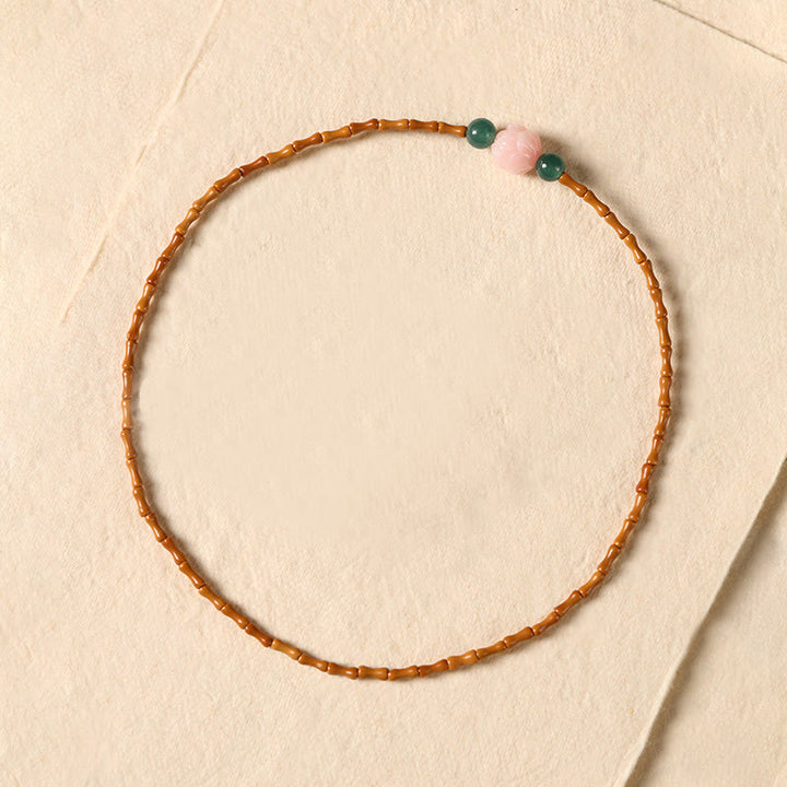 Buddha Stones Bracelet double cercle en noyau d'olive ultra-fin et lotus, pour une force intérieure renforcée. - image 3