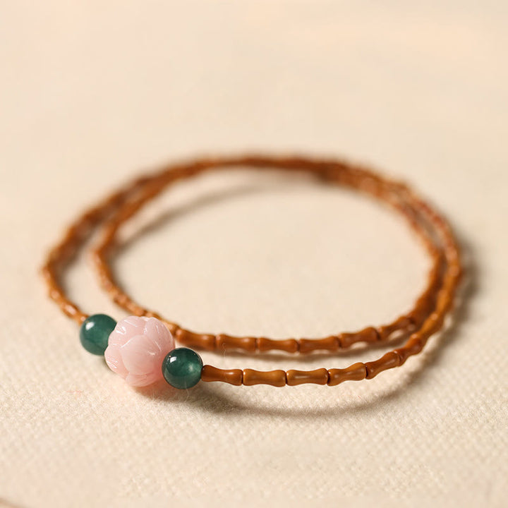 Buddha Stones Bracelet double cercle en noyau d'olive ultra-fin et lotus, pour une force intérieure renforcée. - Noyau d'olive (Tour de poignet : 14-15 cm) - image 0