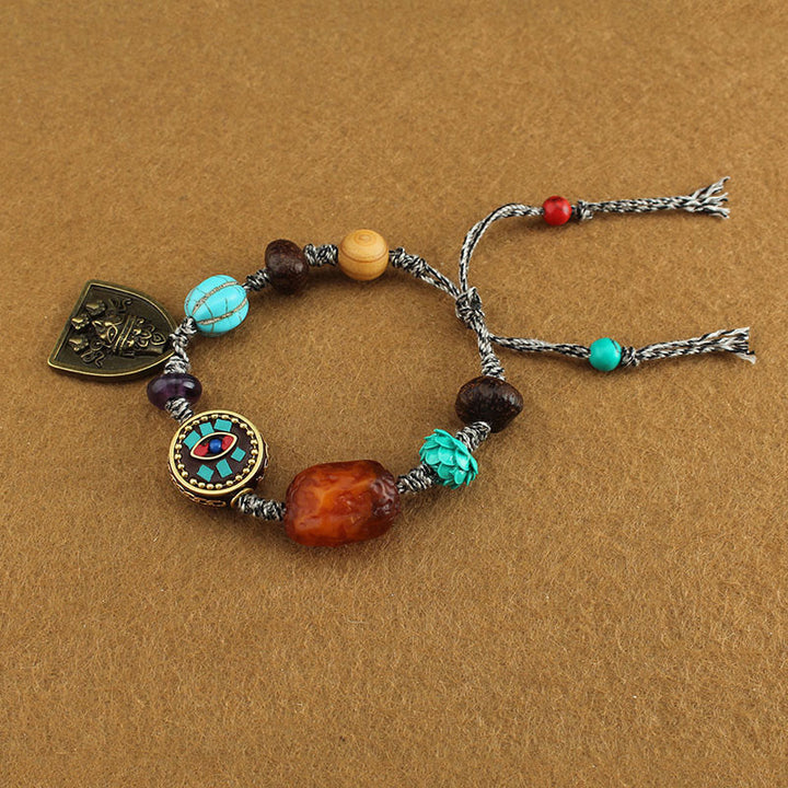 Bracelet de protection en corde avec Buddha Stones tibétaines, œil de Bouddha turquoise, lotus Zakiram - image 4