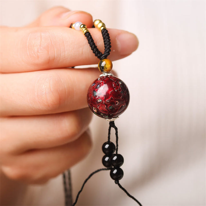 Collier pendentif en Buddha Stones, bois d'ébène, perles de Vénus Aurora, laque, artisanat de la paix - Charme rouge (rouge aléatoire) - image 1