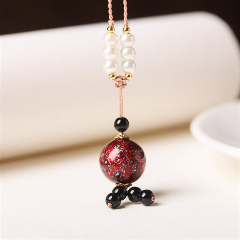 Collier pendentif en perles artisanales en bois d'ébène et laque Aurora , Buddha Stones - Charme rouge foncé (rouge aléatoire) - image 1