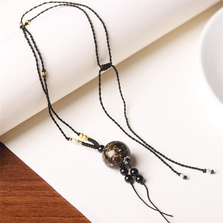 Collier pendentif en perles artisanales en bois d'ébène et laque Aurora , Buddha Stones - Breloque en or noir (or noir aléatoire) - image 17