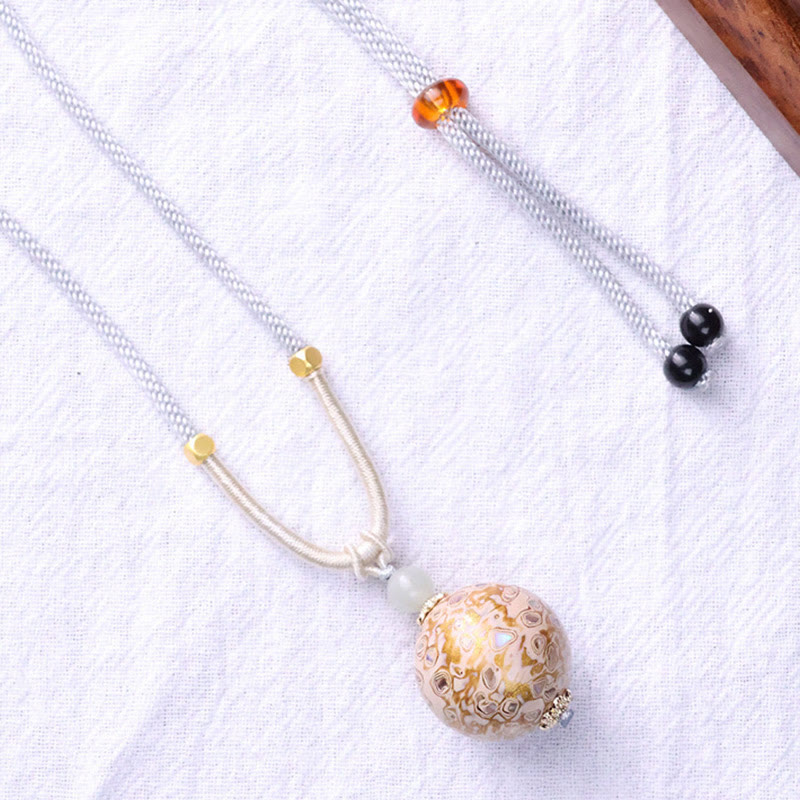 Collier pendentif en perles artisanales en bois d'ébène et laque colorée, Buddha Stones - image 11