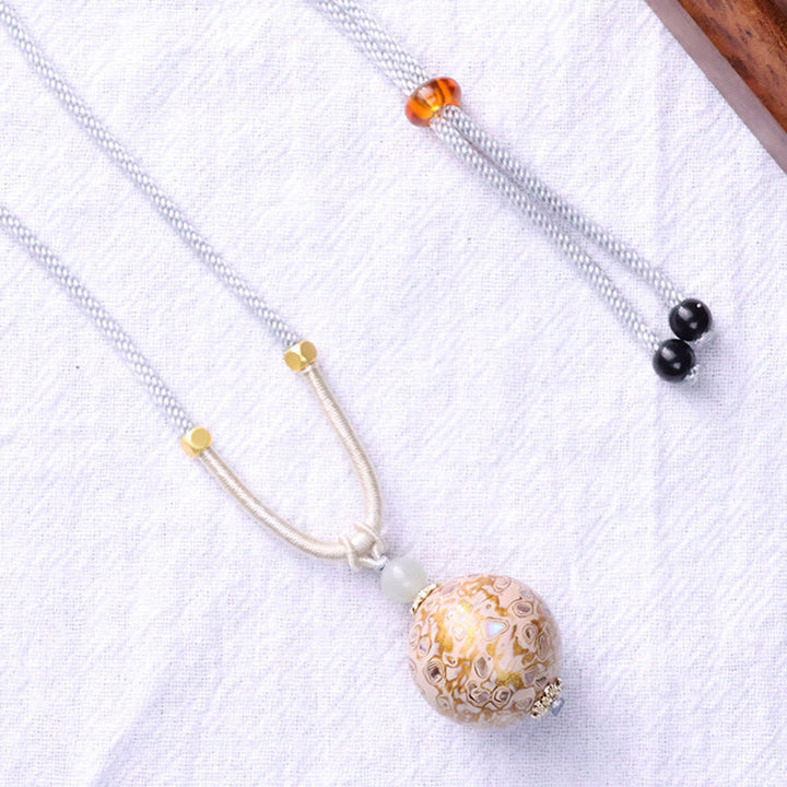 Collier pendentif en perles artisanales en bois d'ébène et laque colorée, Buddha Stones - image 11