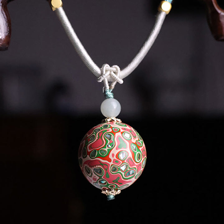 Collier pendentif en perles artisanales en bois d'ébène et laque colorée, Buddha Stones - image 4