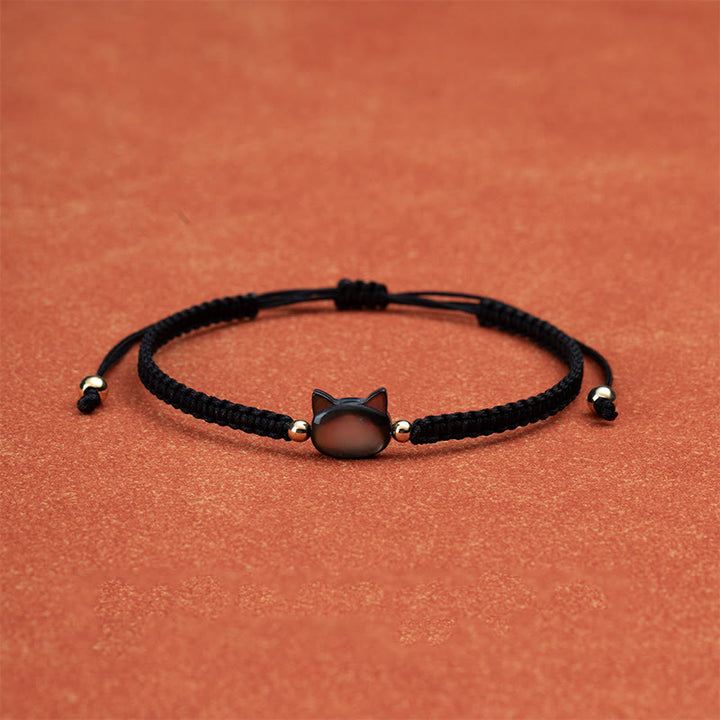Bracelet de connexion en coquillage et fil rouge avec tête de chat sans visage et Buddha Stones - image 1