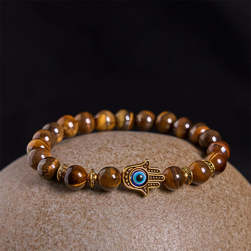 Bracelet courageux en perles œil de tigre et Buddha Stones - image 2