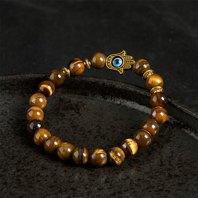 Bracelet courageux en perles œil de tigre et Buddha Stones - image 3