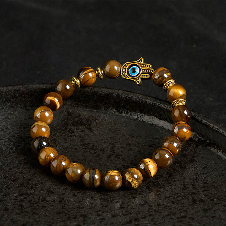 Bracelet courageux en perles œil de tigre et Buddha Stones - image 3