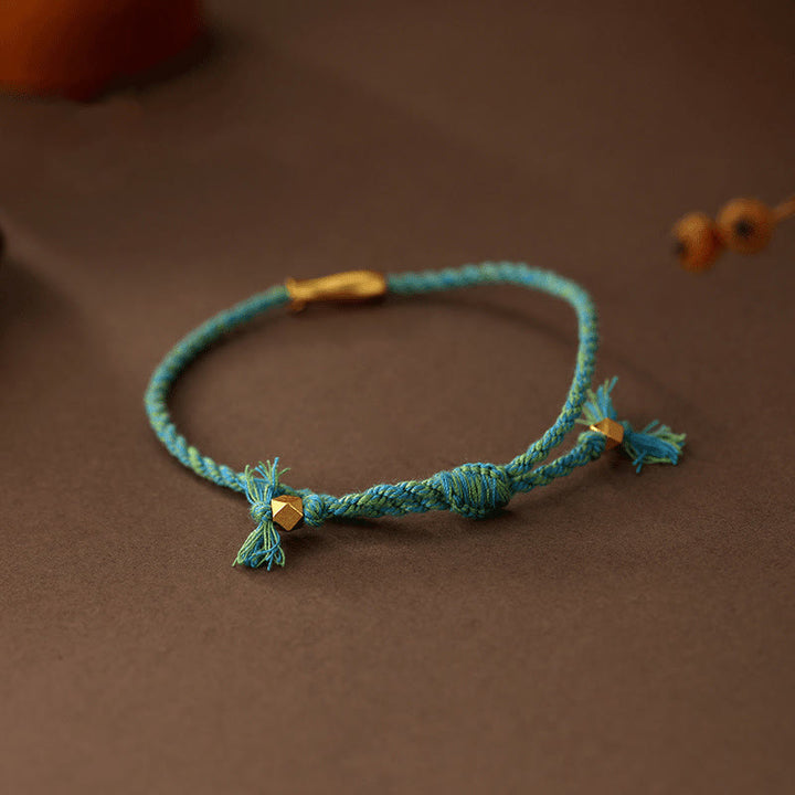Bracelet porte-bonheur en corde et cuivre avec Buddha Stones et poisson koï - image 2