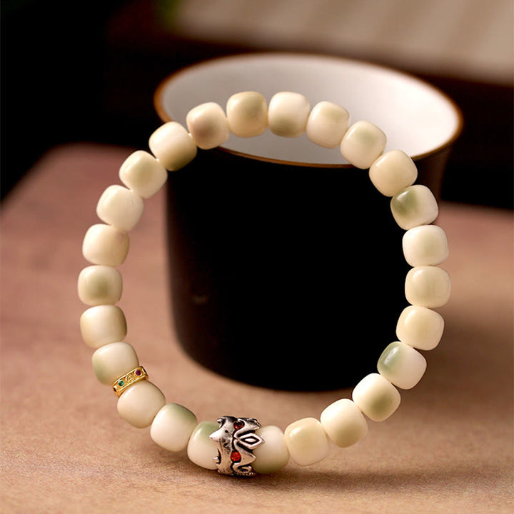 Bracelet de sagesse Garuda en cuivre martelé et graines de Bodhi en Buddha Stones - Graine de Bodhi et Garuda (circonférence du poignet : 15-17 cm) - image 0