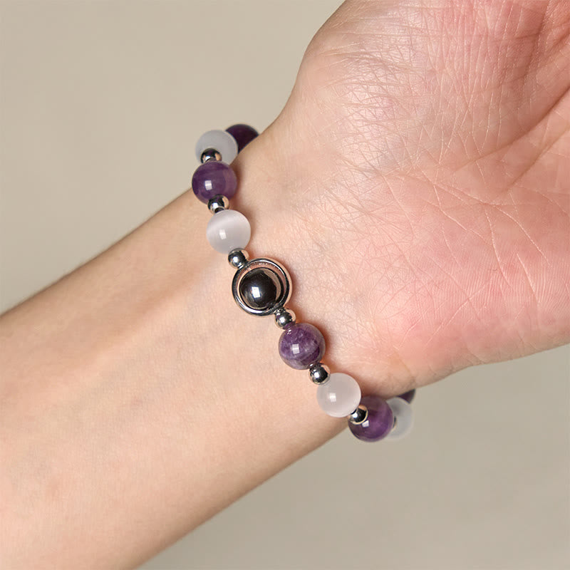 Bracelet d'équilibre en perles d'améthyste naturelle et œil de chat blanc de Buddha Stones - image 3