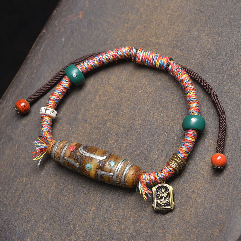 Bracelet de protection en corde de perles tibétaines Dzi à neuf yeux, fabriqué à la main par Buddha Stones - Cordes colorées et perle Dzi à neuf yeux (tour de poignet : 16-20 cm) - image 0