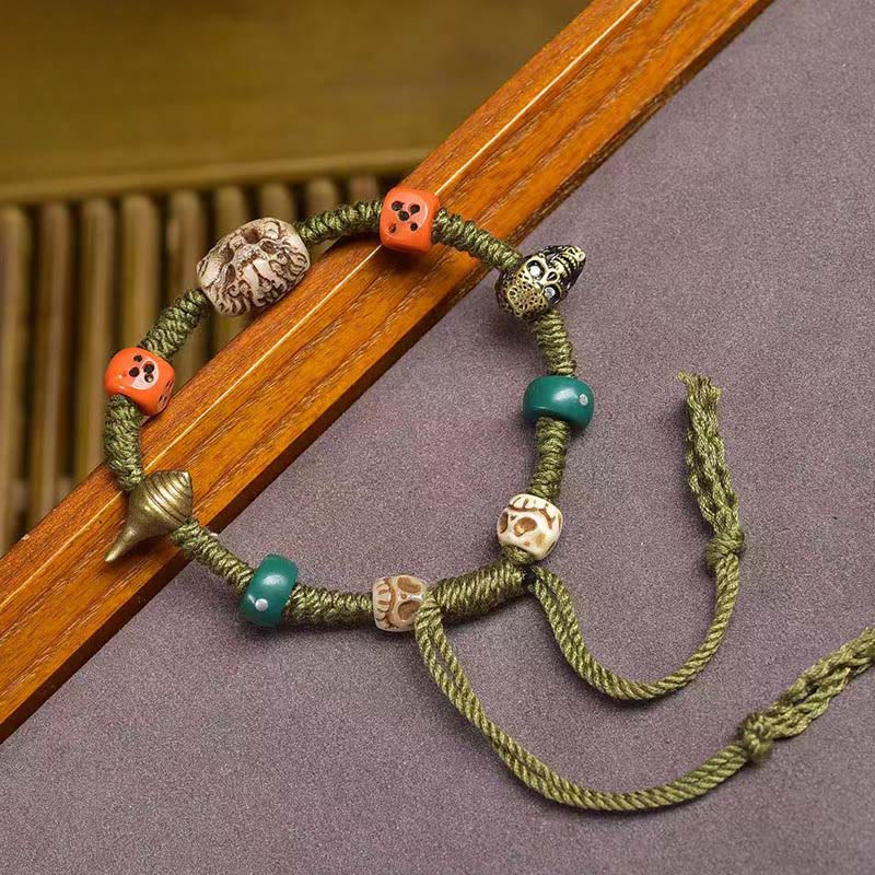 Bracelet en corde fait main avec des Buddha Stones et des motifs de dragon tibétain - image 1
