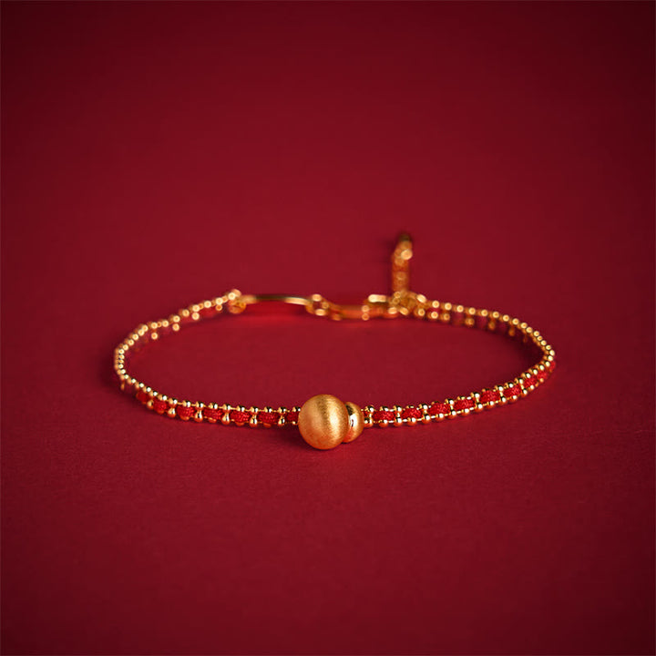 Bracelet de force et de richesse en cuivre et laiton avec Buddha Stones et cordon rouge - image 1