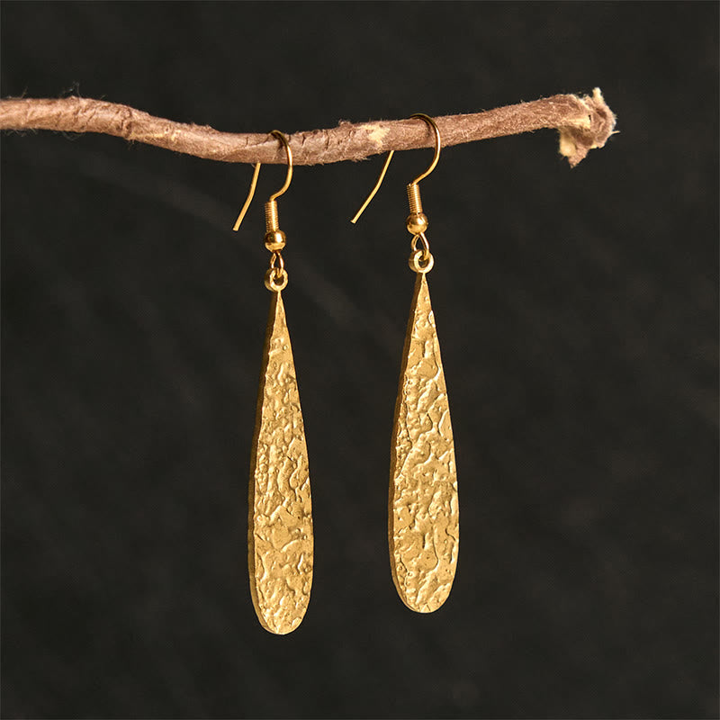 Boucles d'oreilles élégantes en acier titane avec Buddha Stones et marteau d'équilibre - Forme de larme dorée (poteaux en acier titane) - image 0