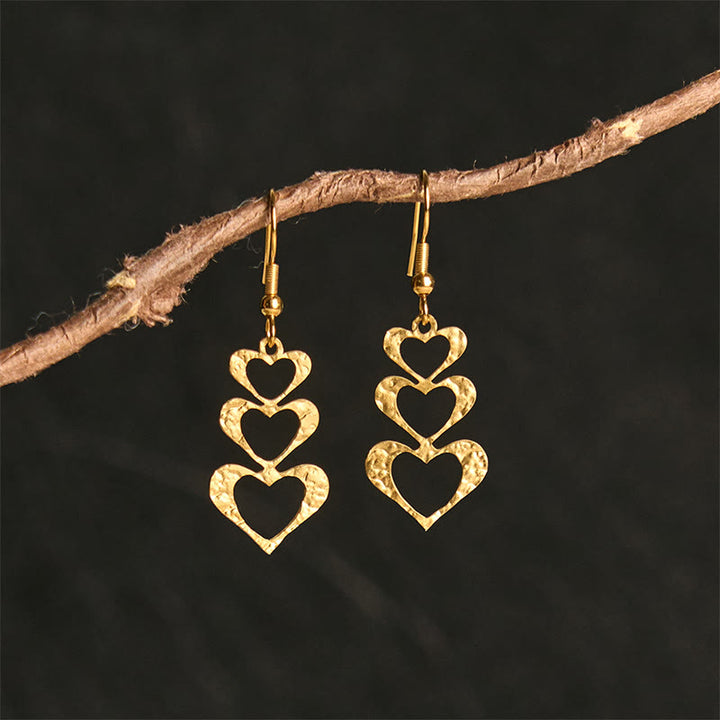 Boucles d'oreilles élégantes en acier titane avec Buddha Stones et marteau d'équilibre - Forme de cœur doré (poteaux en acier titane) - image 11