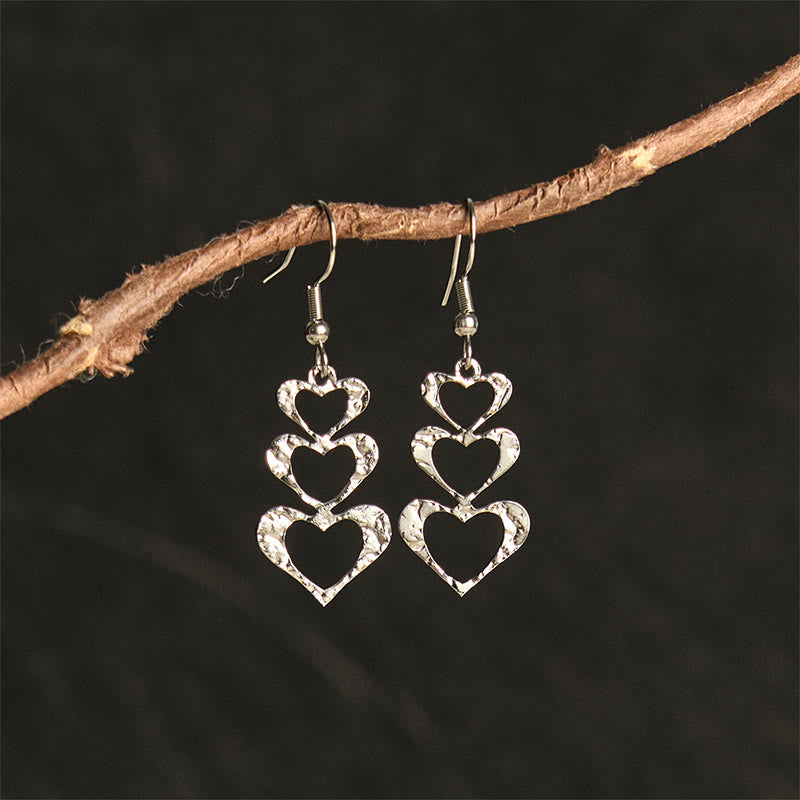 Boucles d'oreilles élégantes en acier titane avec Buddha Stones et marteau d'équilibre - Forme de cœur argentée (poteaux en acier titane) - image 13