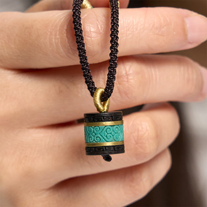 Collier pendentif cylindre de paix en bois d'ébène turquoise et Buddha Stones - Bois d'ébène - image 0