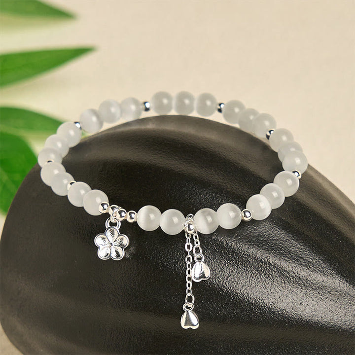 Bracelet de paix en œil de chat et fleurs de cerisier en Buddha Stones - image 1