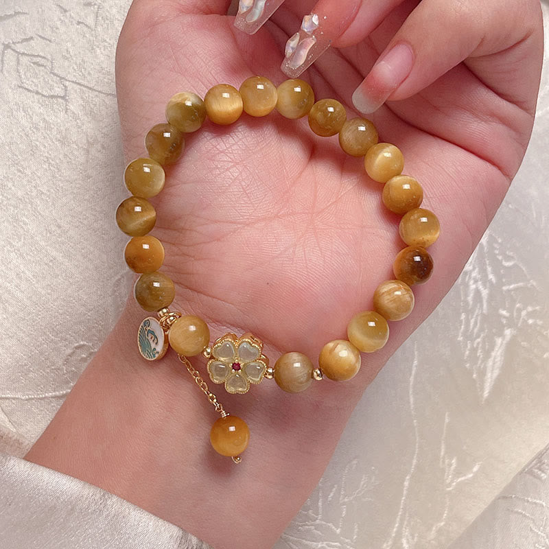 Bracelet courage en forme de clochette et œil de tigre doré naturel Buddha Stones - image 10