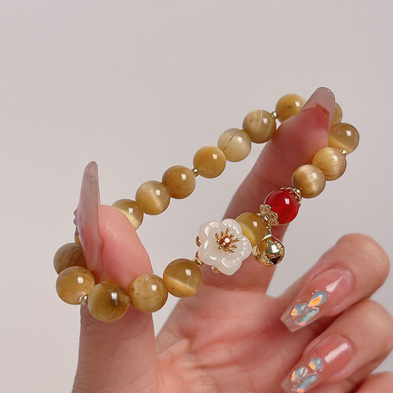 Bracelet courage en forme de clochette et œil de tigre doré naturel Buddha Stones - image 1