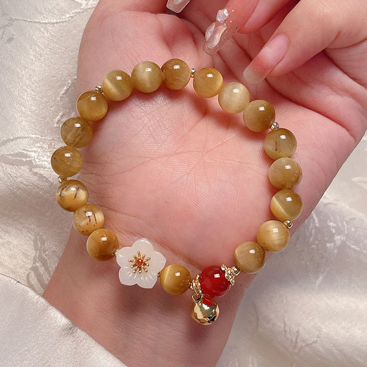 Bracelet courage en forme de clochette et œil de tigre doré naturel Buddha Stones - image 4