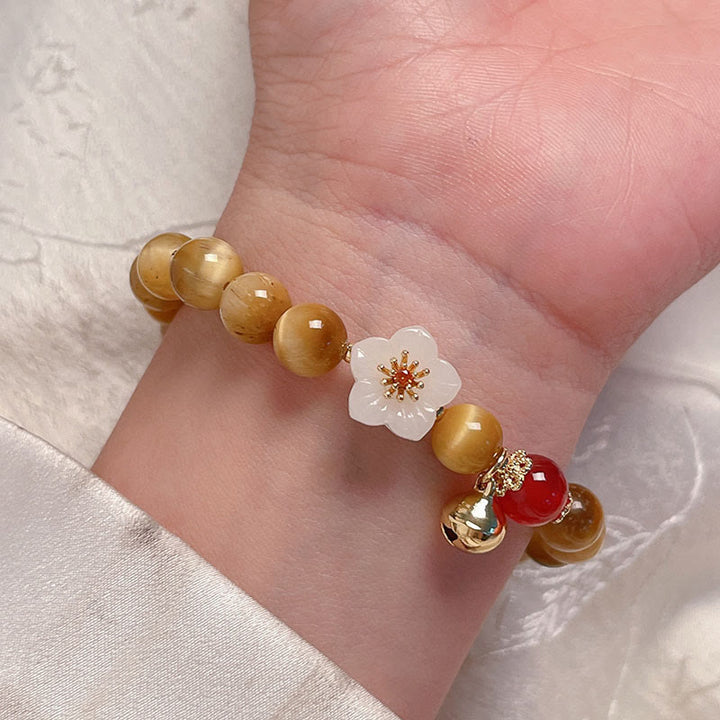 Bracelet courage en forme de clochette et œil de tigre doré naturel Buddha Stones - image 2