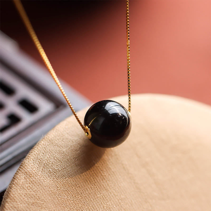 Collier avec pendentif en argent sterling 925 et perles rondes d'ambre Buddha Stones, symbole de confiance et de concentration - Ambre et argent sterling 925 - image 0